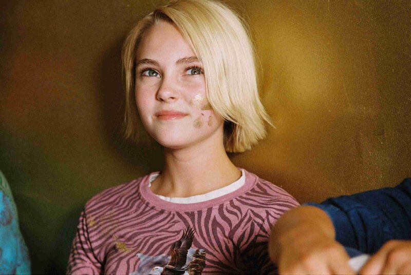 blonde girl with gold paint