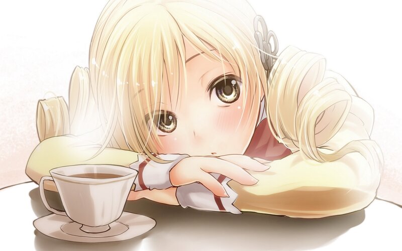 Blonde girl with tea cup