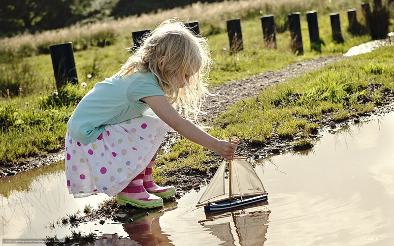Blonde Girl with Toy Boat