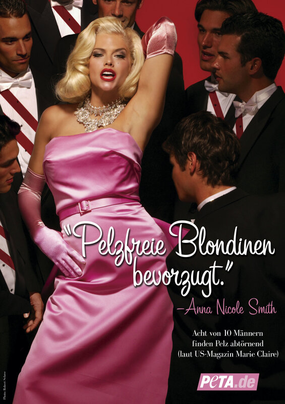Blonde in pink dress surrounded by men