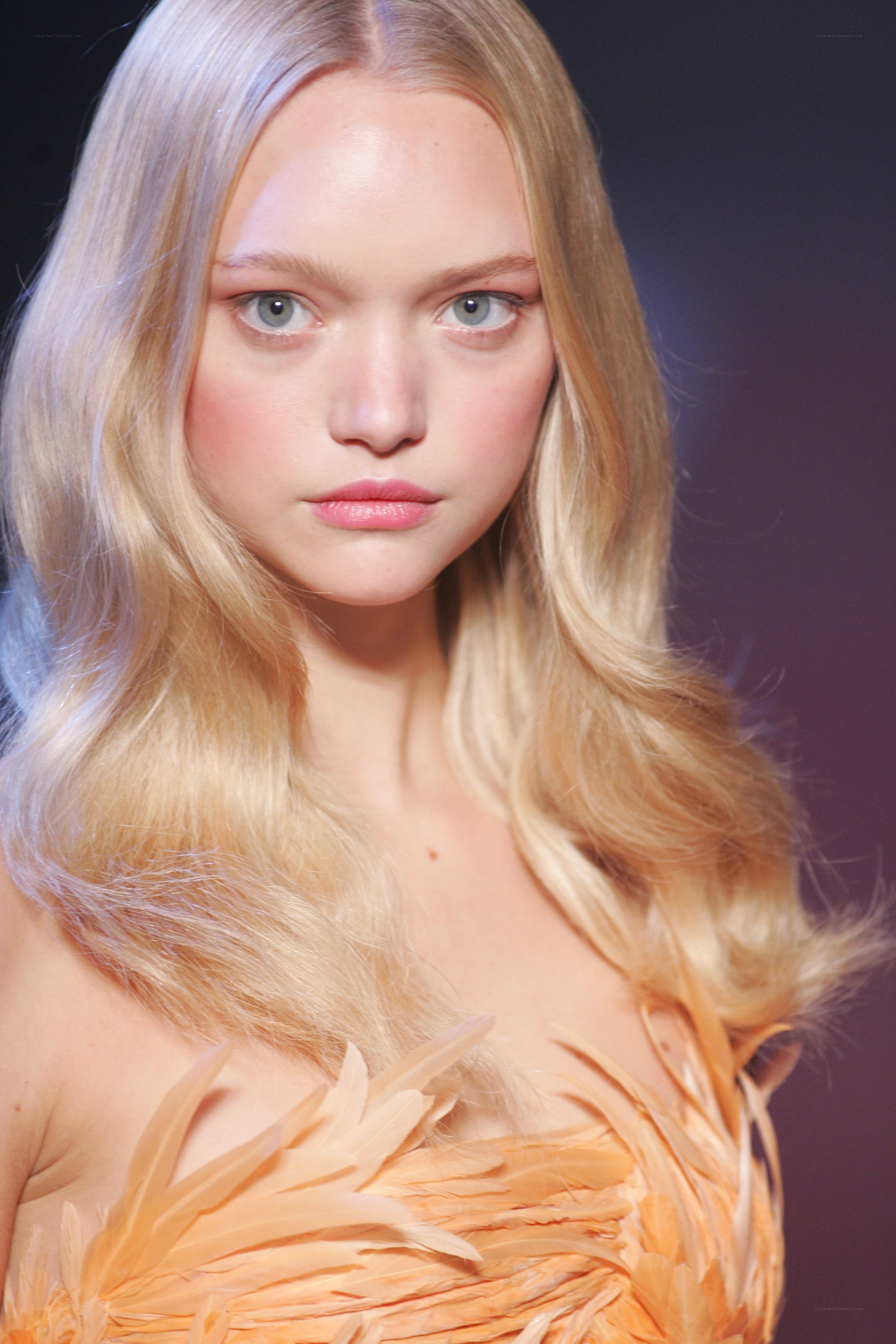 blonde model with feather dress