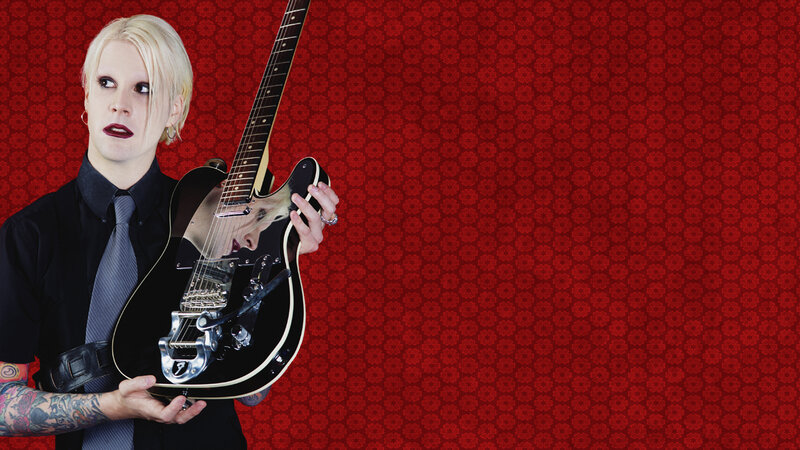 blonde musician with electric guitar