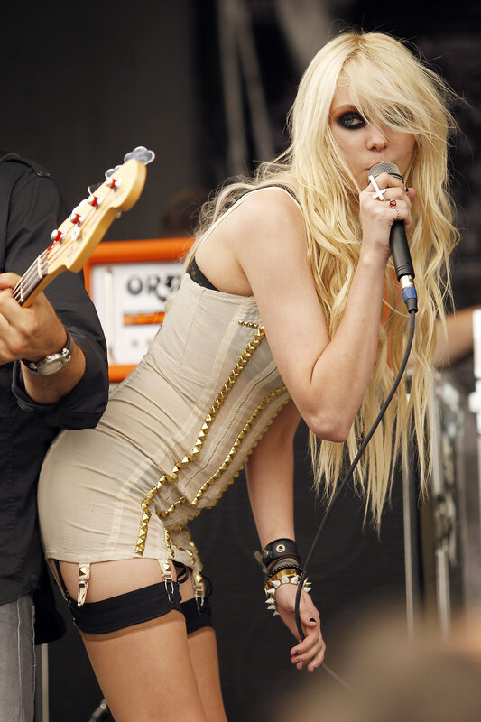 Blonde singer performing on stage
