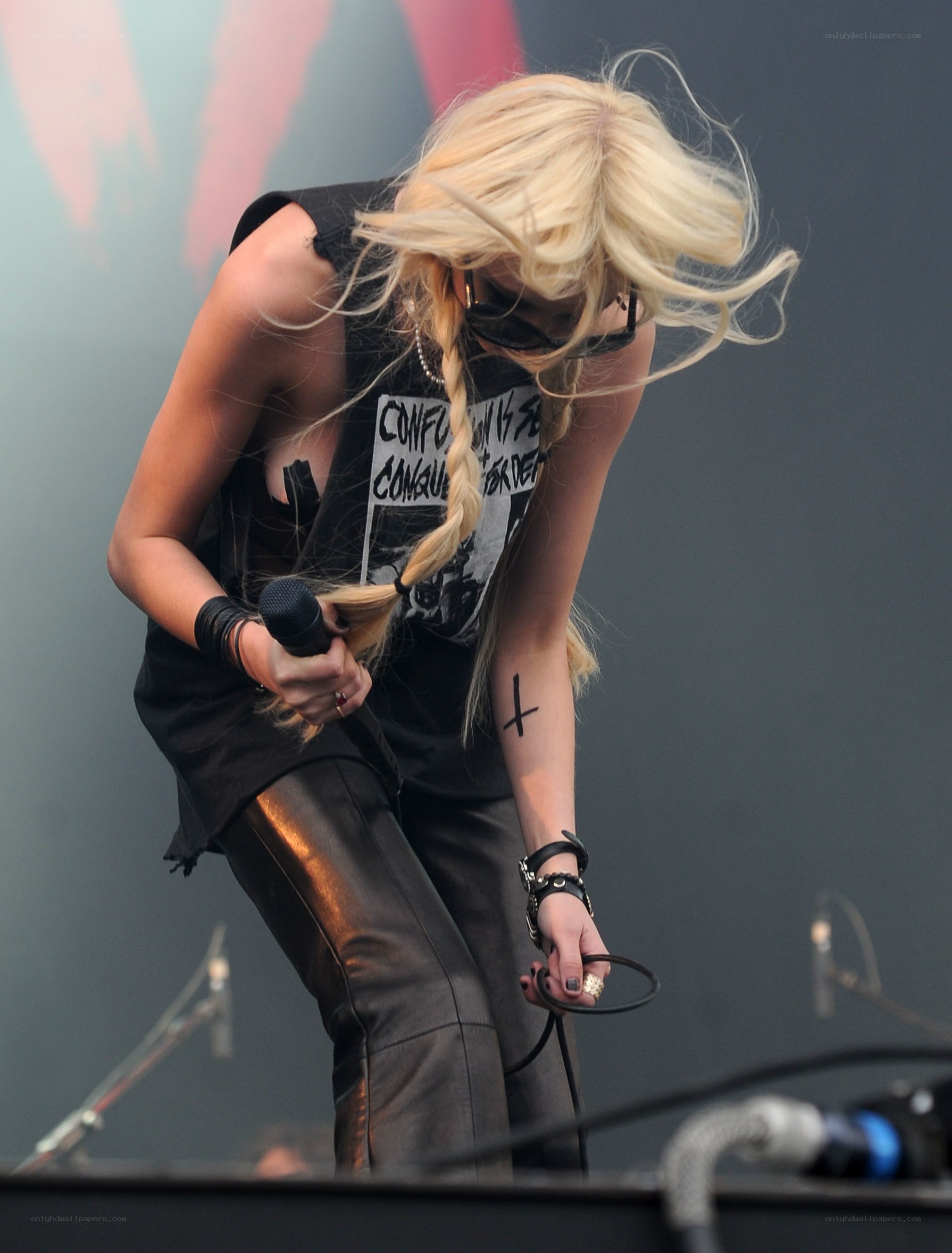 blonde singer performing on stage