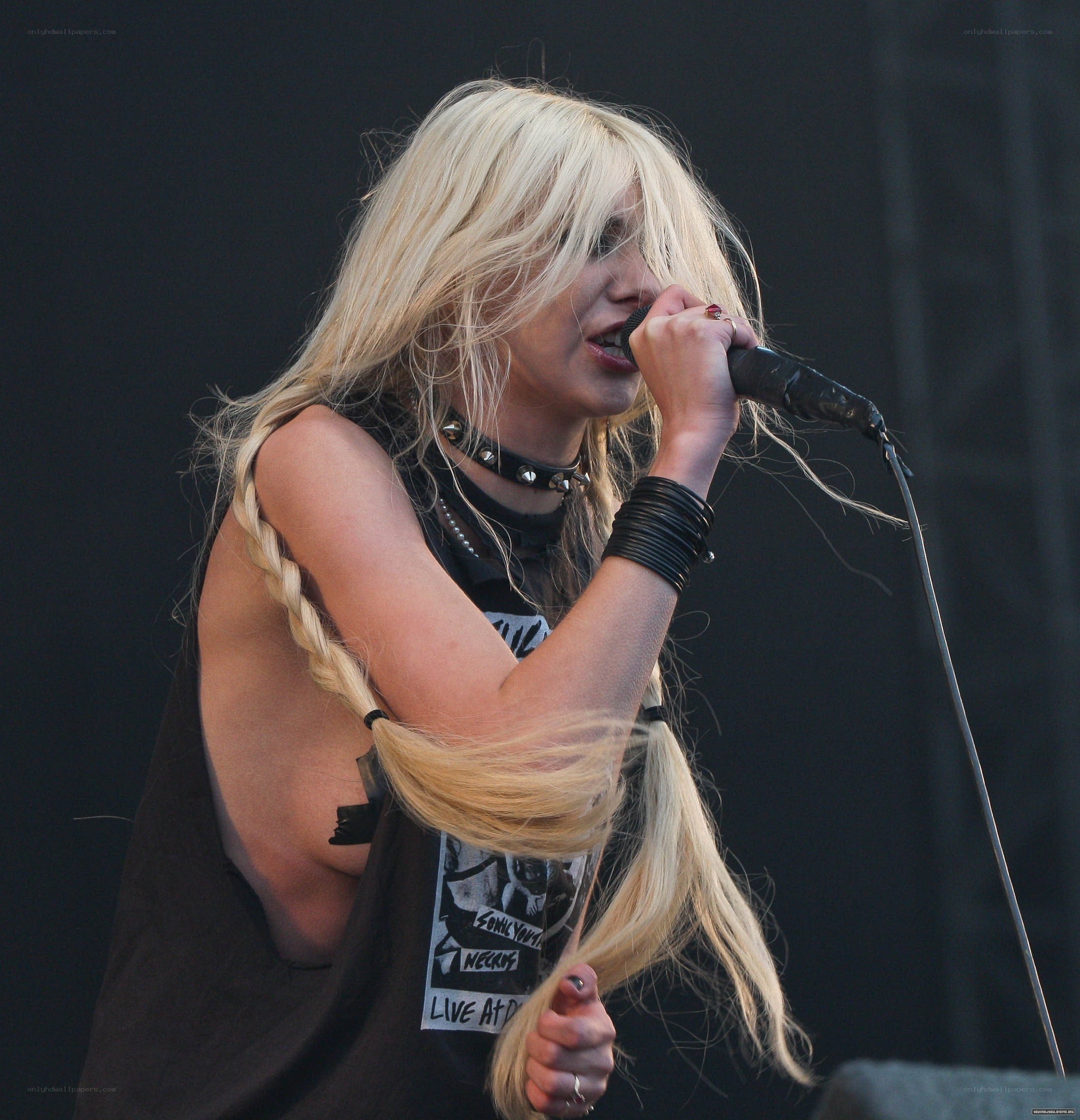 blonde singer performing on stage