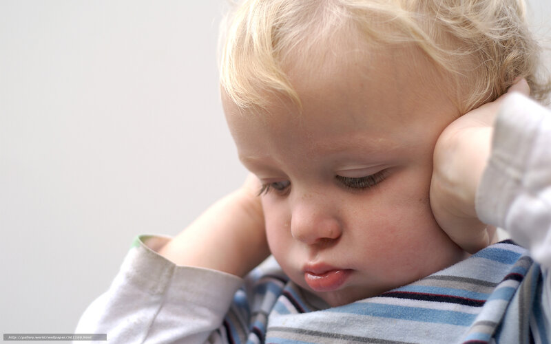 Blonde Toddler Covering Ears