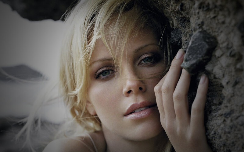 Blonde Woman Against Rock