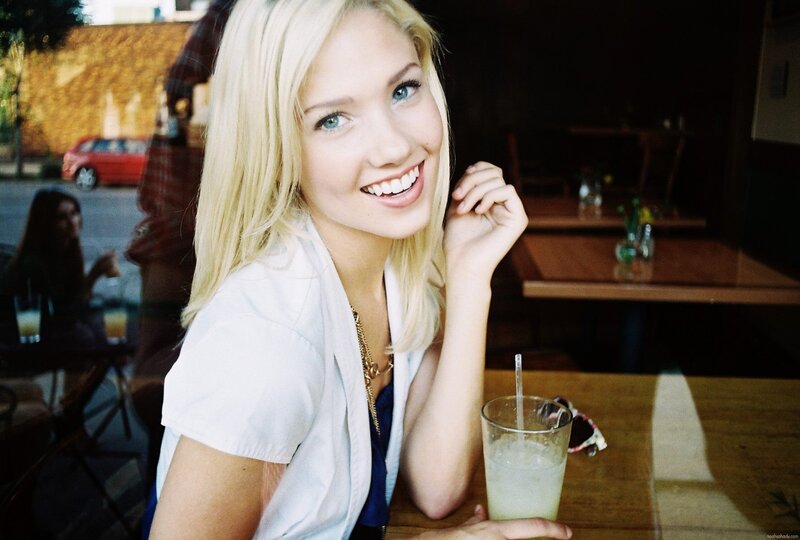 Blonde Woman at Table — White, Relaxed