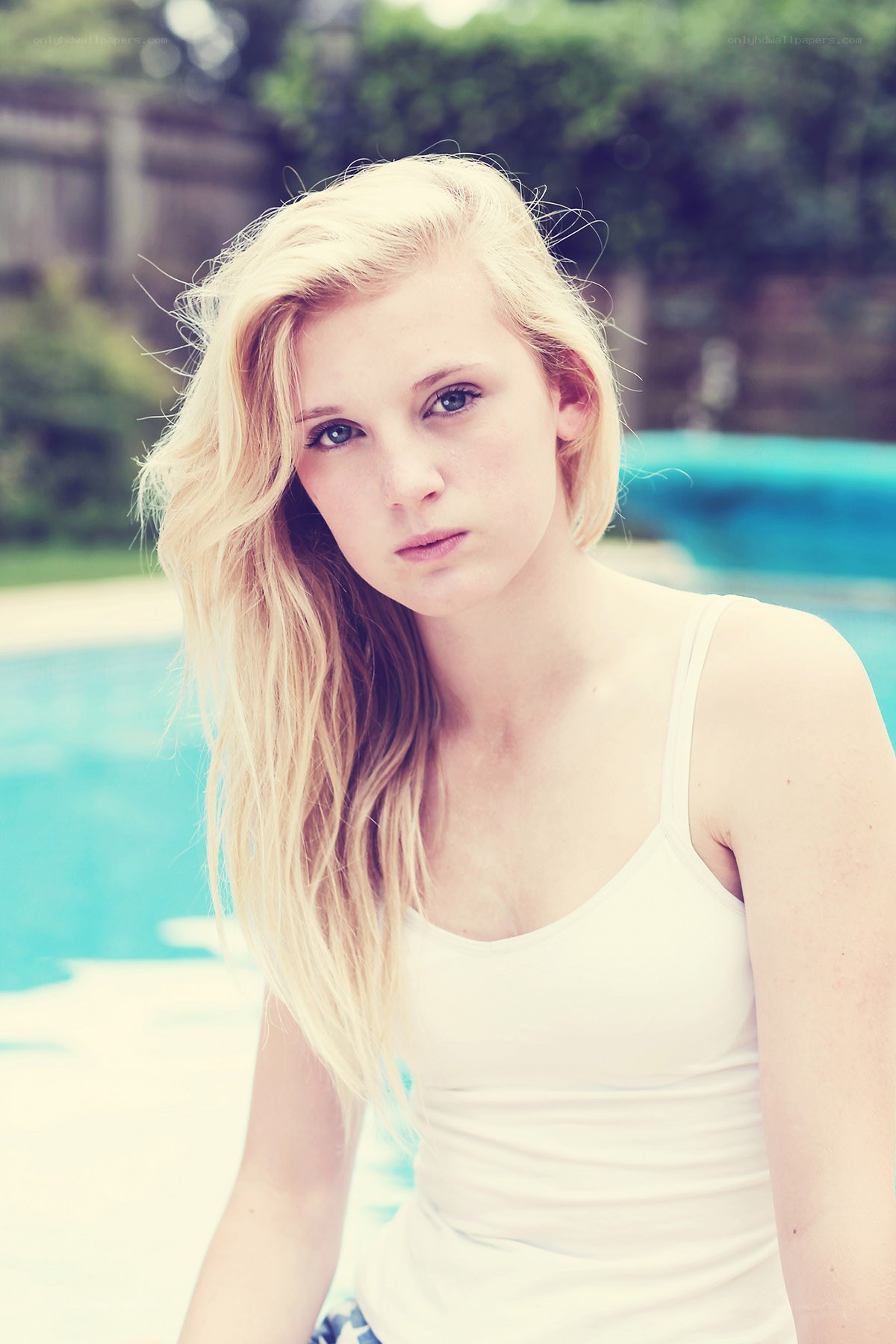 blonde woman by pool