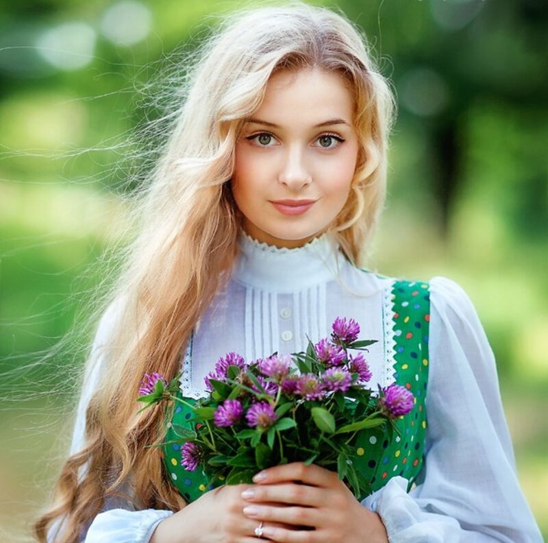 Blonde Woman Holding Flowers — Green