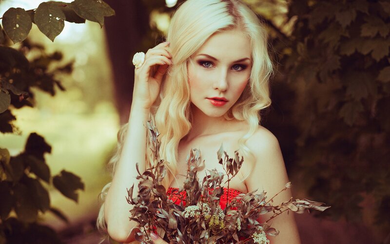 Blonde Woman Holding Flowers — Red