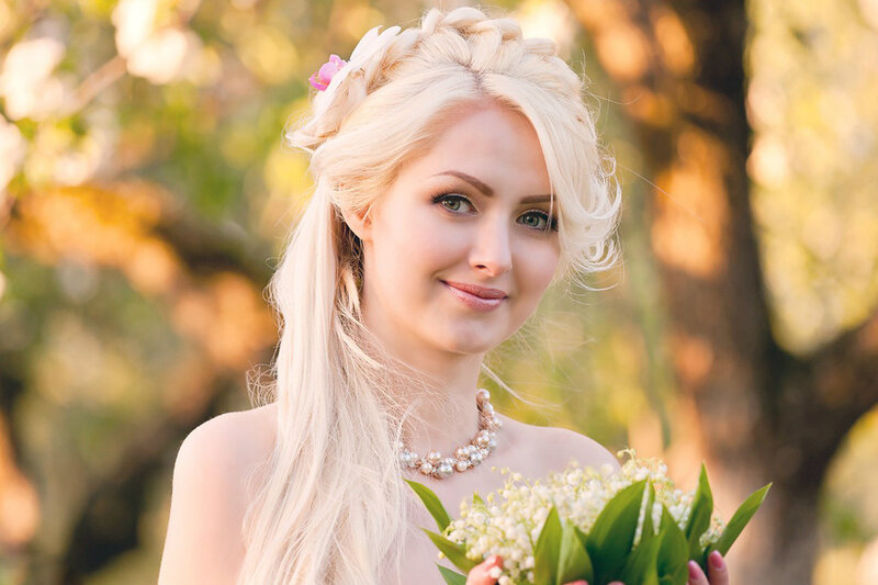 Blonde Woman Holding Flowers