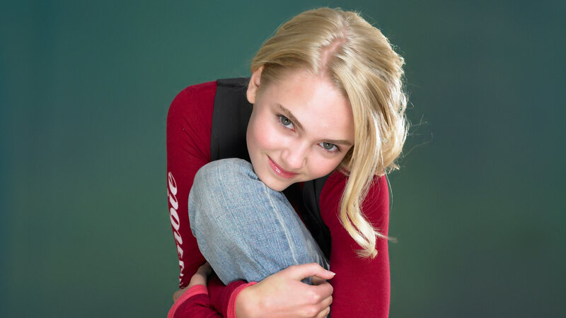 Blonde Woman Hugging Knees — Green