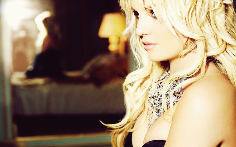 blonde woman in a dimly lit room