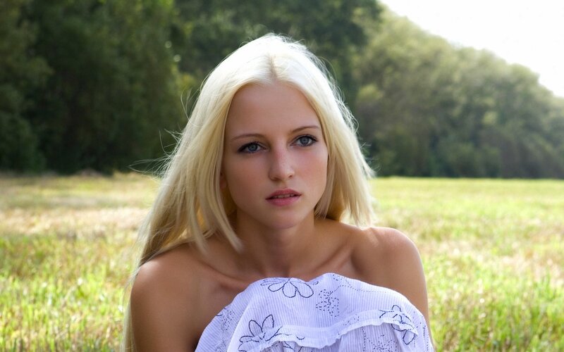 blonde woman in a field