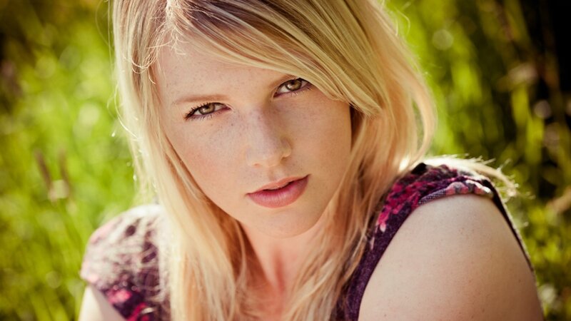 blonde woman in a field