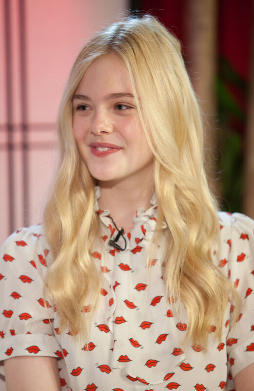 blonde woman in a lip-print shirt