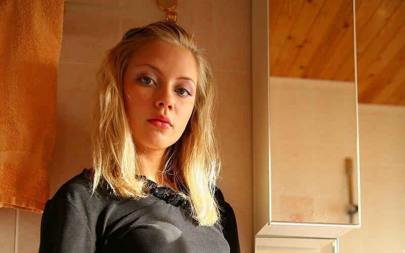 Blonde Woman in Bathroom — Brown