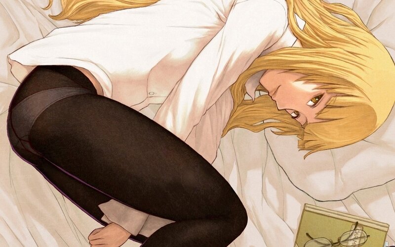blonde woman in bed