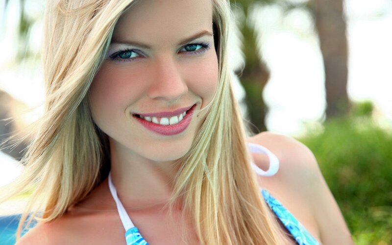 blonde woman in bikini smiling