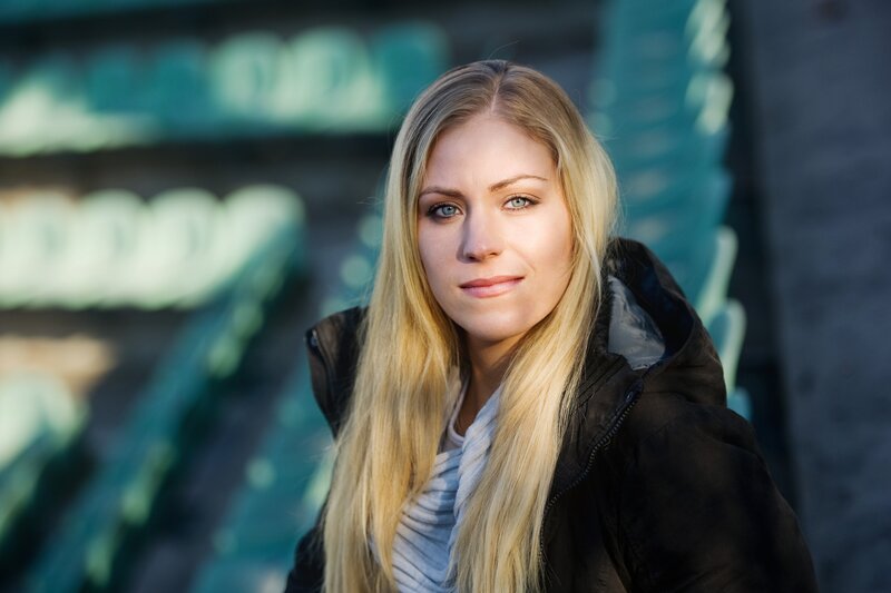 blonde woman in black jacket