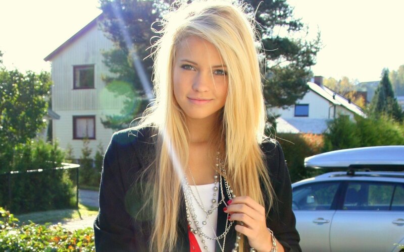 blonde woman in black jacket