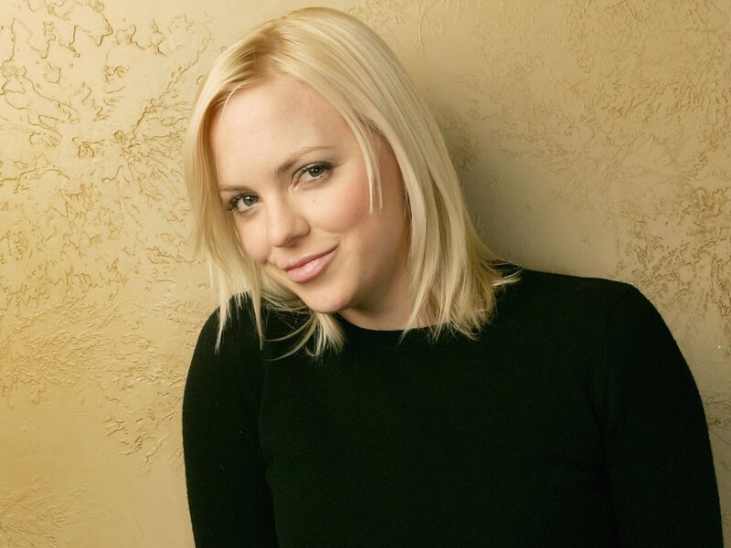 blonde woman in black top