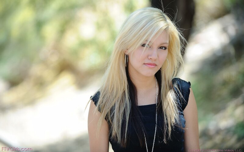 blonde woman in black top