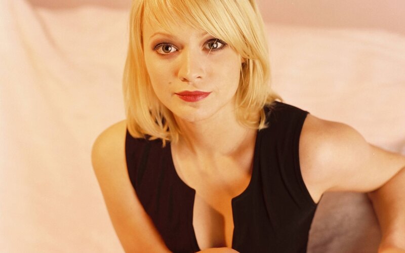 blonde woman in black top