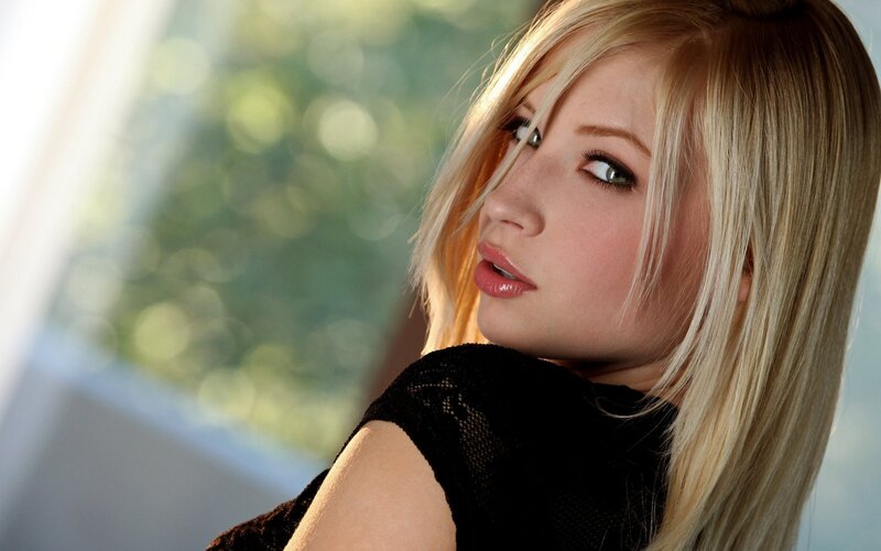 blonde woman in black top