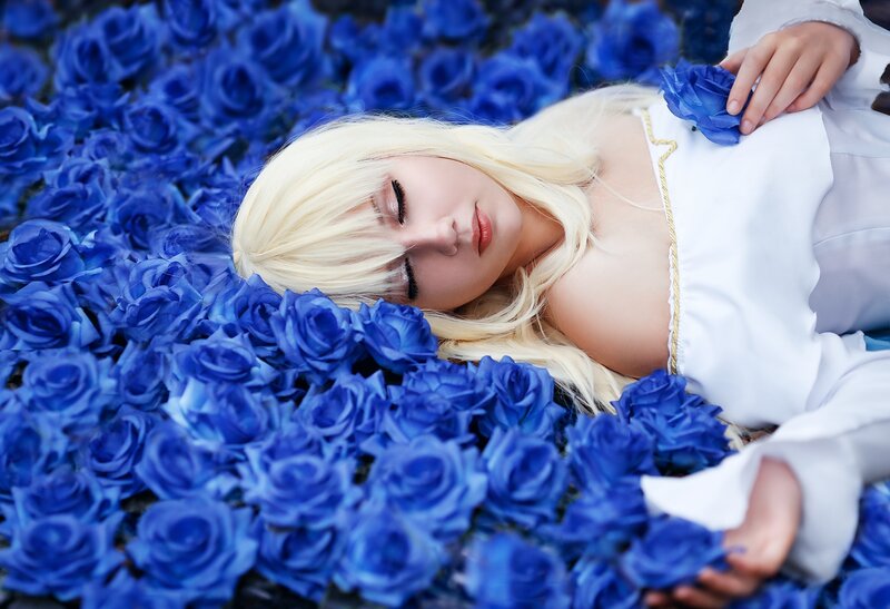Blonde Woman in Blue Roses