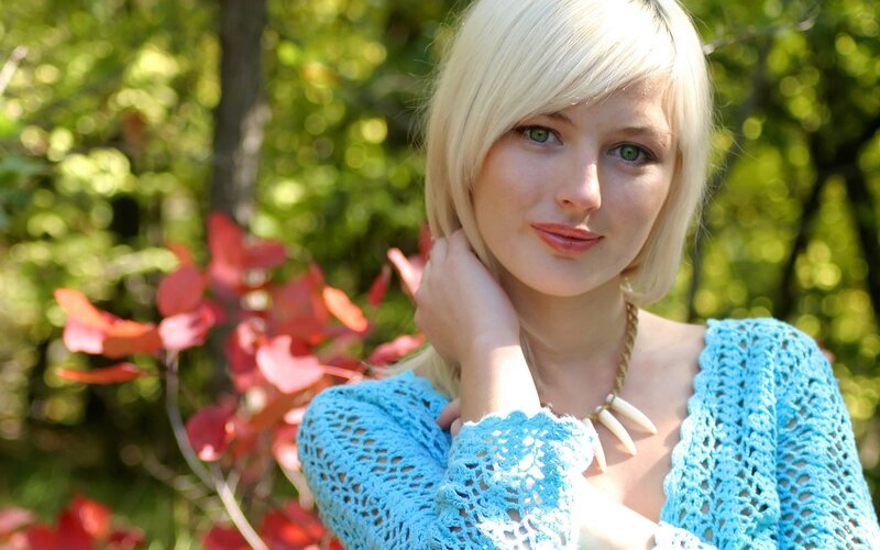blonde woman in blue sweater