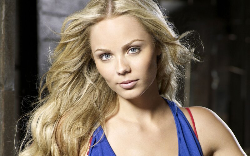blonde woman in blue top