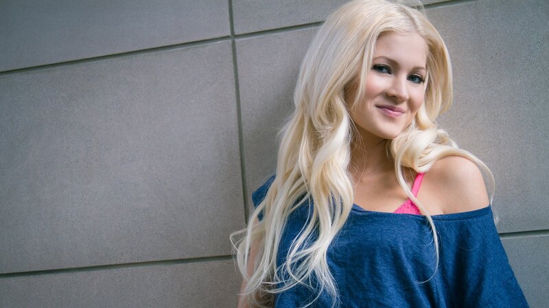 blonde woman in blue top
