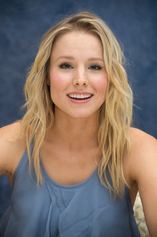 blonde woman in blue top
