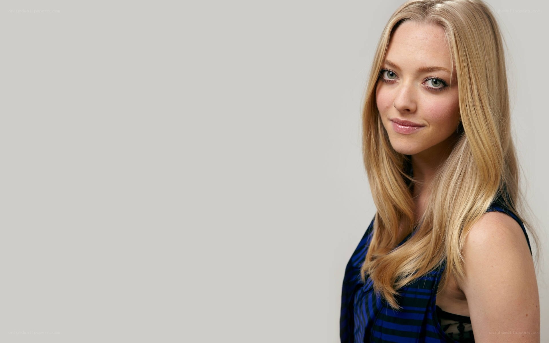 blonde woman in blue top