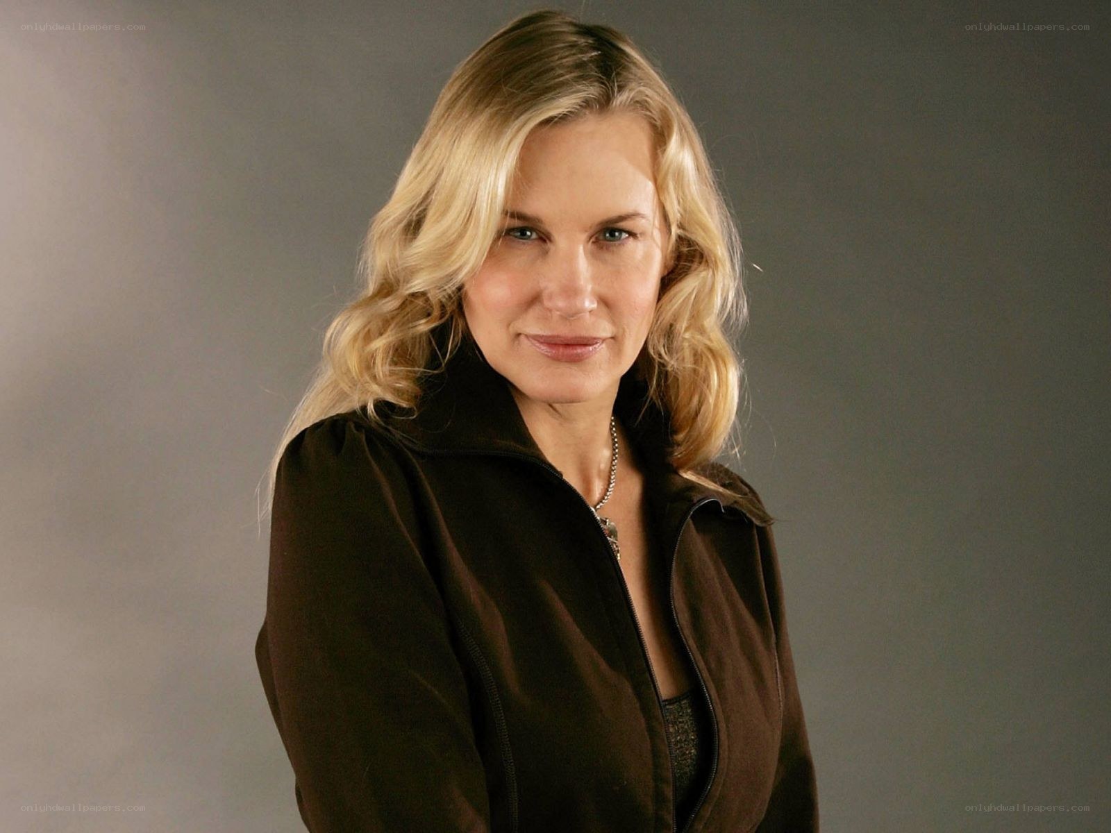 blonde woman in brown jacket