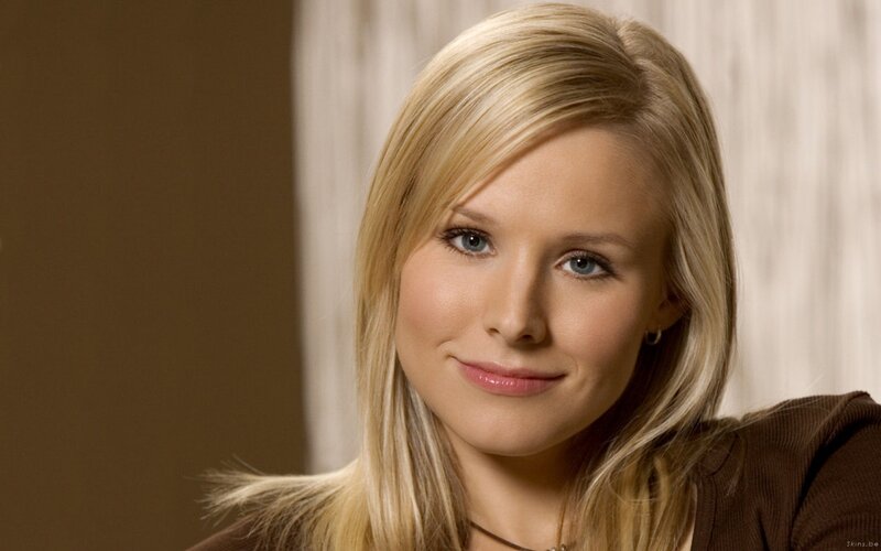 blonde woman in brown top