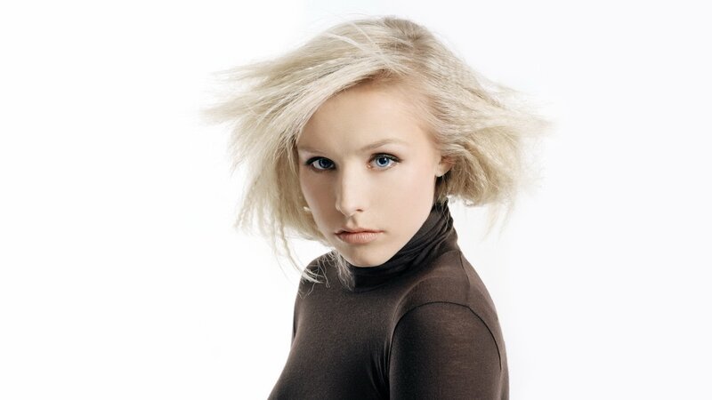 blonde woman in brown turtleneck