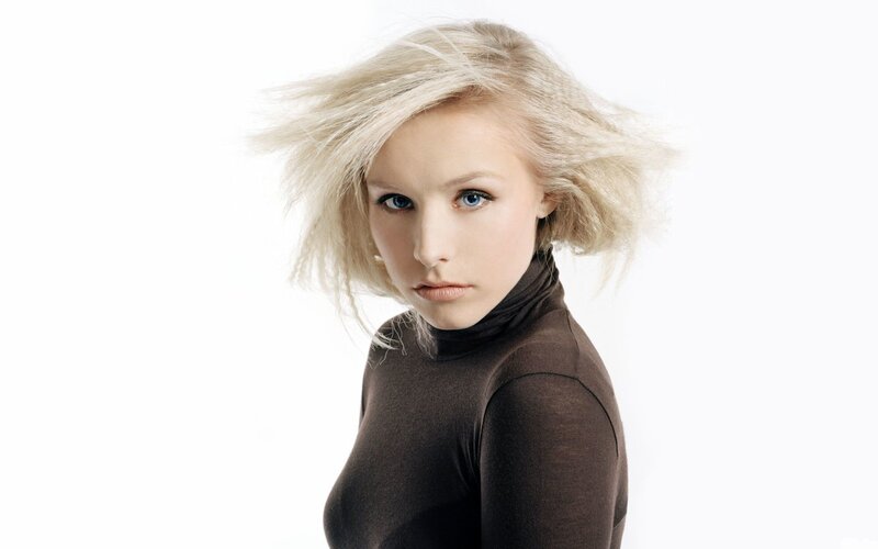 blonde woman in brown turtleneck
