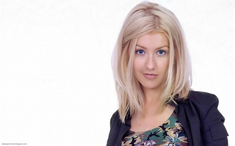 blonde woman in camouflage top
