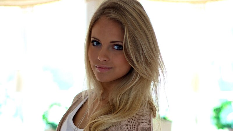 blonde woman in cardigan