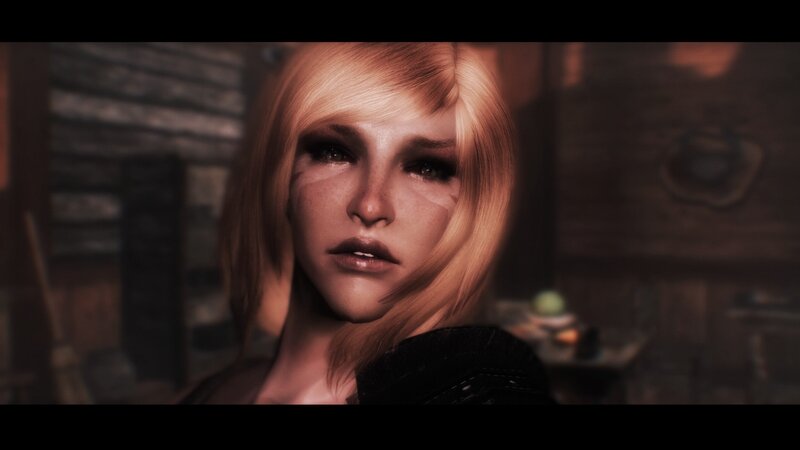 blonde woman in dim room