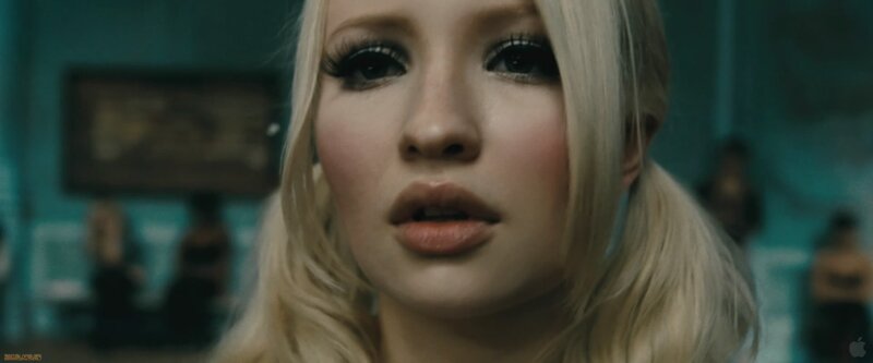 blonde woman in dimly lit room
