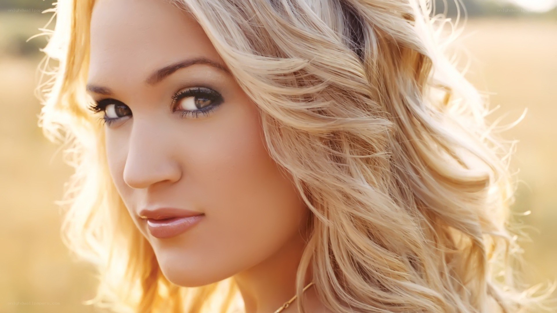 blonde woman in field
