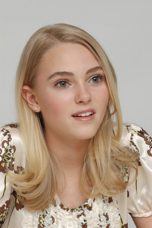 blonde woman in floral blouse