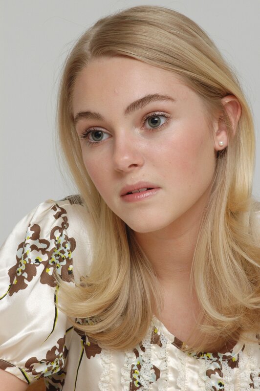 blonde woman in floral blouse
