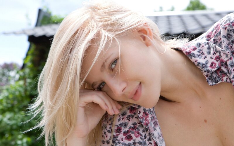 blonde woman in floral shirt