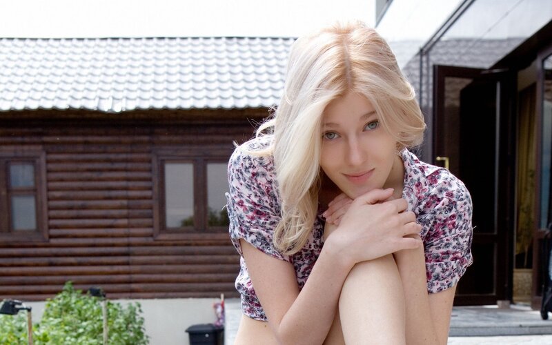 Blonde woman in floral shirt
