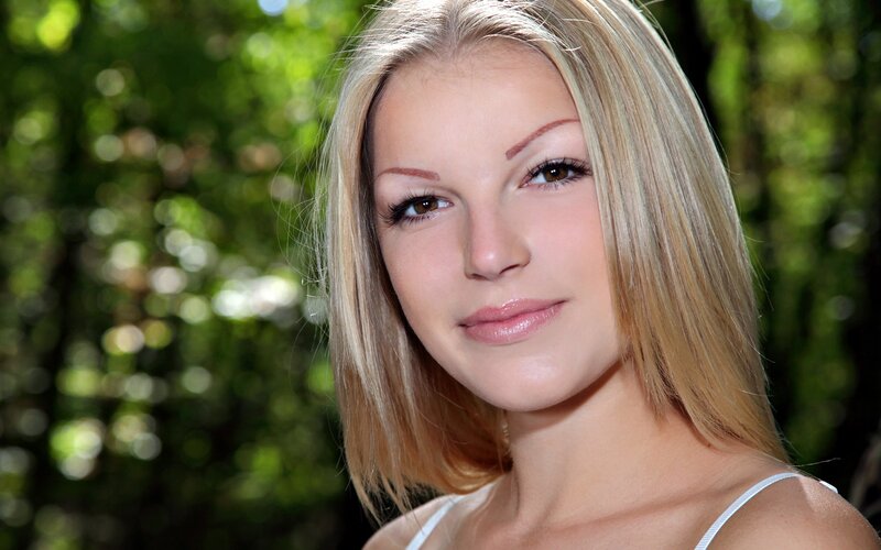 blonde woman in forest